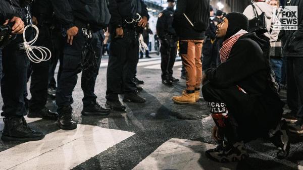 NYPD officers, protester