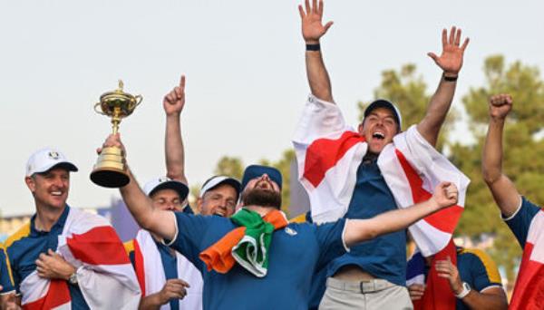 Shane Lowry celebrates with the Ryder Cup.