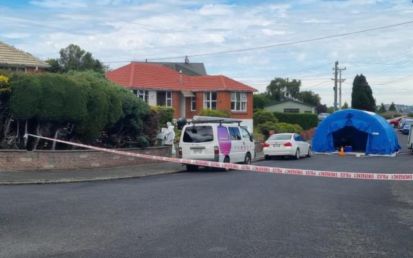Police at the scene of an unexplained death at Hillary Street, Liberton, Dunedin on 30 January 2024.