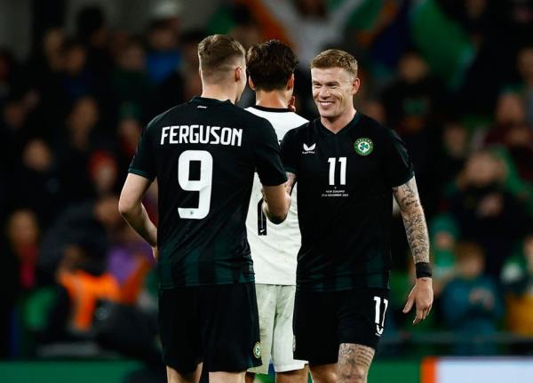 Ireland's James McClean shakes hands with Evan Ferguson after he is substituted during his last internatio<em></em>nal appearance