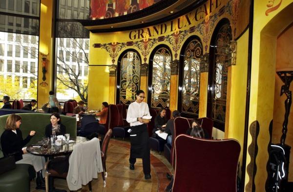 Brandi Steck works the front, circular room at the Grand Lux cafe.