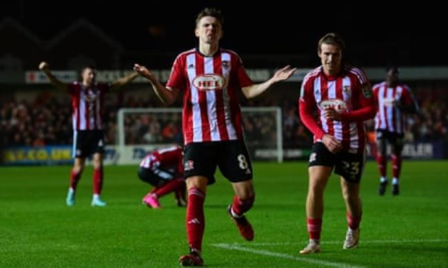Ryan Trevitt celebrates scoring one of his goals for Exeter