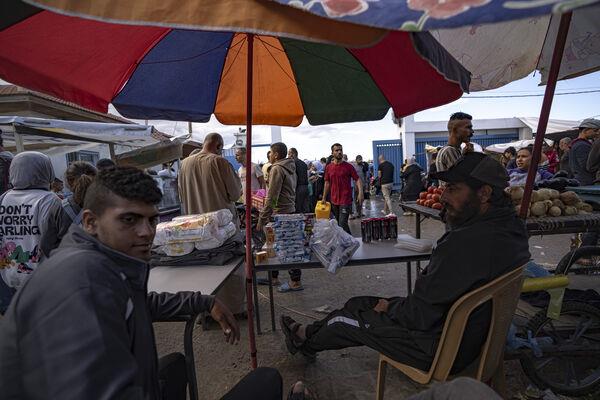 Palestinians displaced by the Israeli bombardment of the Gaza Strip are gathering at a UNDP-provided tent camp in Khan Younis, Wednesday, Nov.15, 2023. (AP Photo/Fatima Shbair)