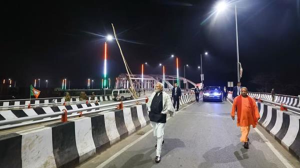 PM Modi in Varanasi inspecting the Shivpur-Phulwaria-Lahartara Marg. Yogi Adityanath is also visible to the right.