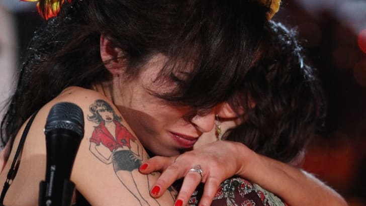 Amy Winehouse hugs her mother Janis after accepting a Grammy Award via video l<em></em>ink on February 10, 2008.