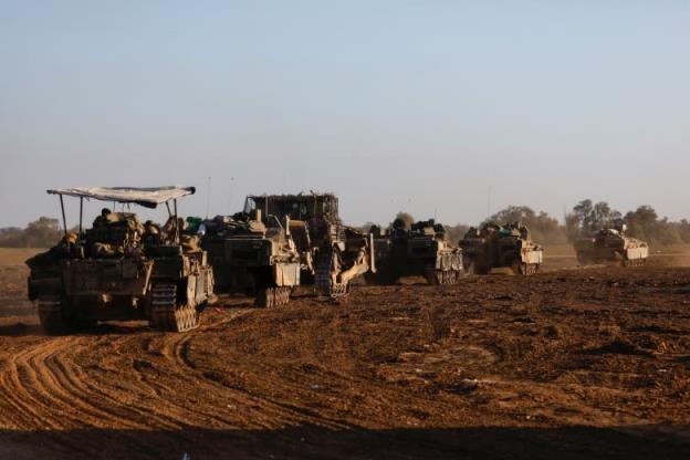 A co<em></em>nvoy of Israeli military rolls into Israel from Gaza, amid the o<em></em>ngoing co<em></em>nflict between Israel and the Palestinian Islamist group Hamas, January 5, 2024. 