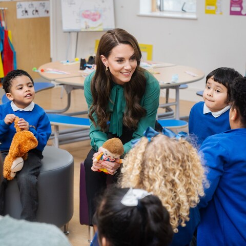 Princess with school children in classroom