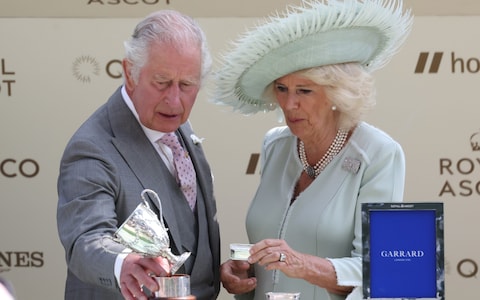 The King knocks over the trophy - Emotio<em></em>nal King Charles on verge of tears after first Royal Ascot winner – and knocks over trophy