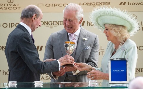 The King and Queen are presented with the winner's cup by the Duke of Kent - Emotio<em></em>nal King Charles on verge of tears after first Royal Ascot winner – and knocks over trophy