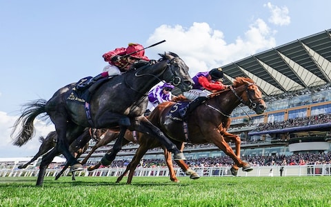 Desert Hero ridden by Tom Marquand (right) pips Valiant King on the line - Emotio<em></em>nal King Charles on verge of tears after first Royal Ascot winner – and knocks over trophy